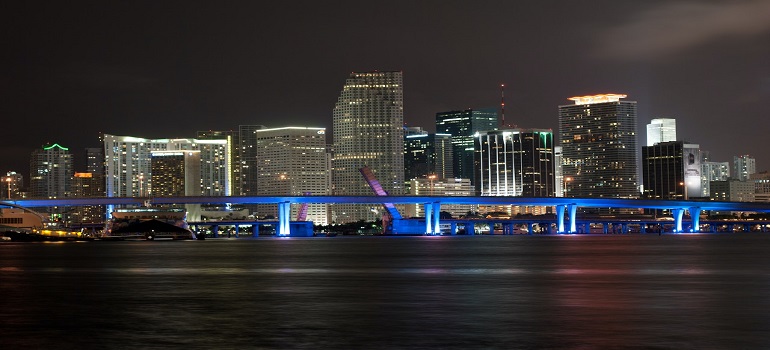 buildings by the sea at night 