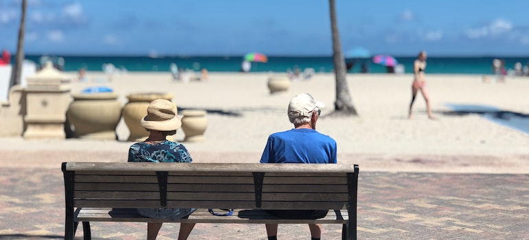 a couple sitting on a bench