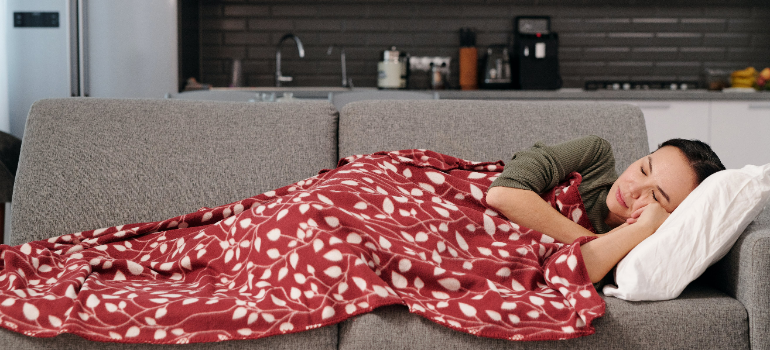 a woman sleeping on the sofa