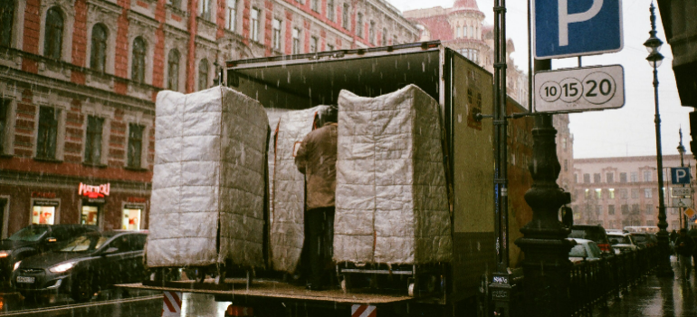 A man from a moving company helping you unload your belongings after moving from Miami to NYC