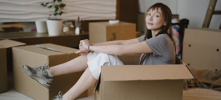 a woman sitting in a box