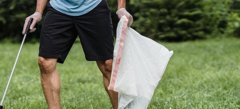 A person cleaning a field