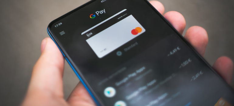 Person paying with a Google card