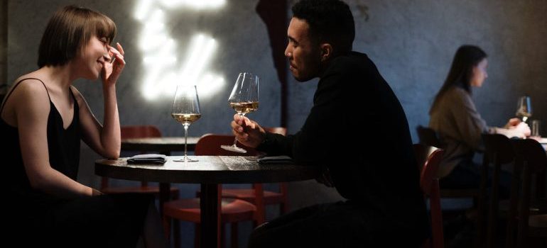 a couple drinking wine in restaurant