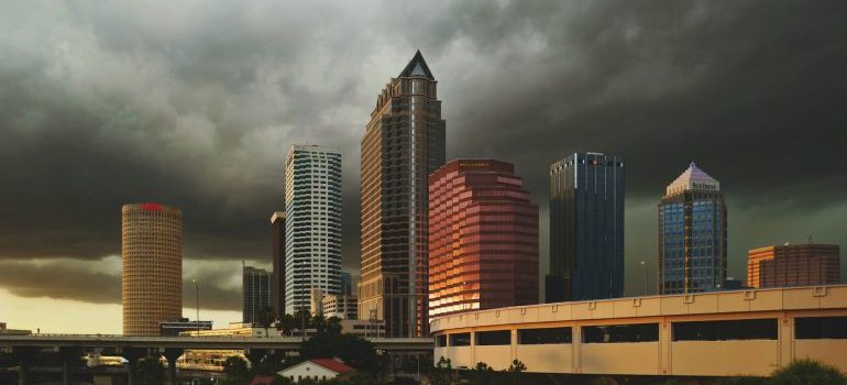 Tall buildings under dark clowds in Tampa