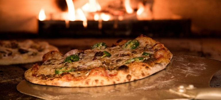 Pizza coming out of an oven in one of top foodie delights to discover after a move to Tampa