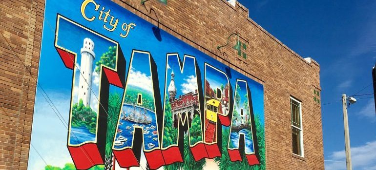 Latge mural on the side of a bulding that reads Tampa