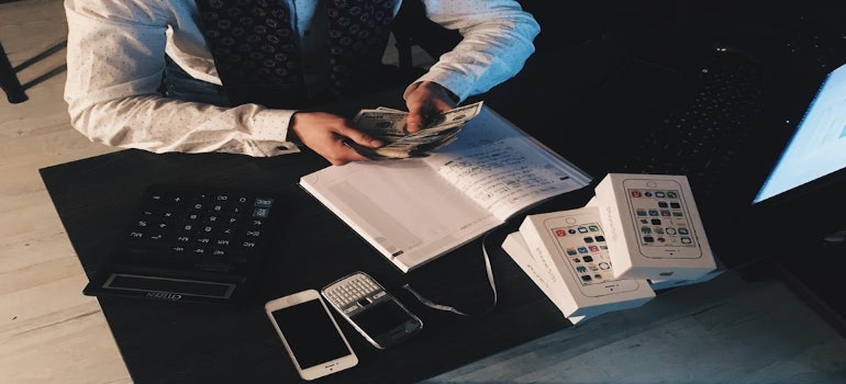 a man counting money when moving from Lakeland to Palm Bay