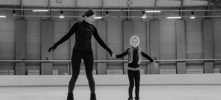 Woman and child skating on ice