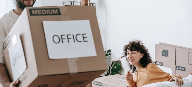 A couple waiting for office movers CT